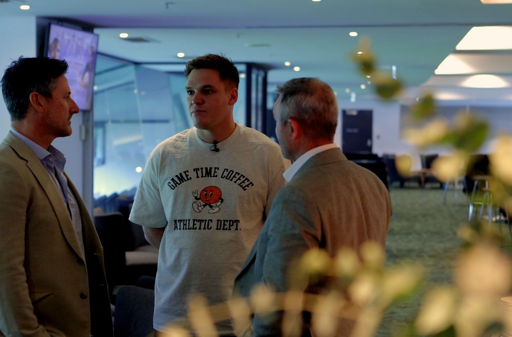 Guests talking over coffee at a Game Time event